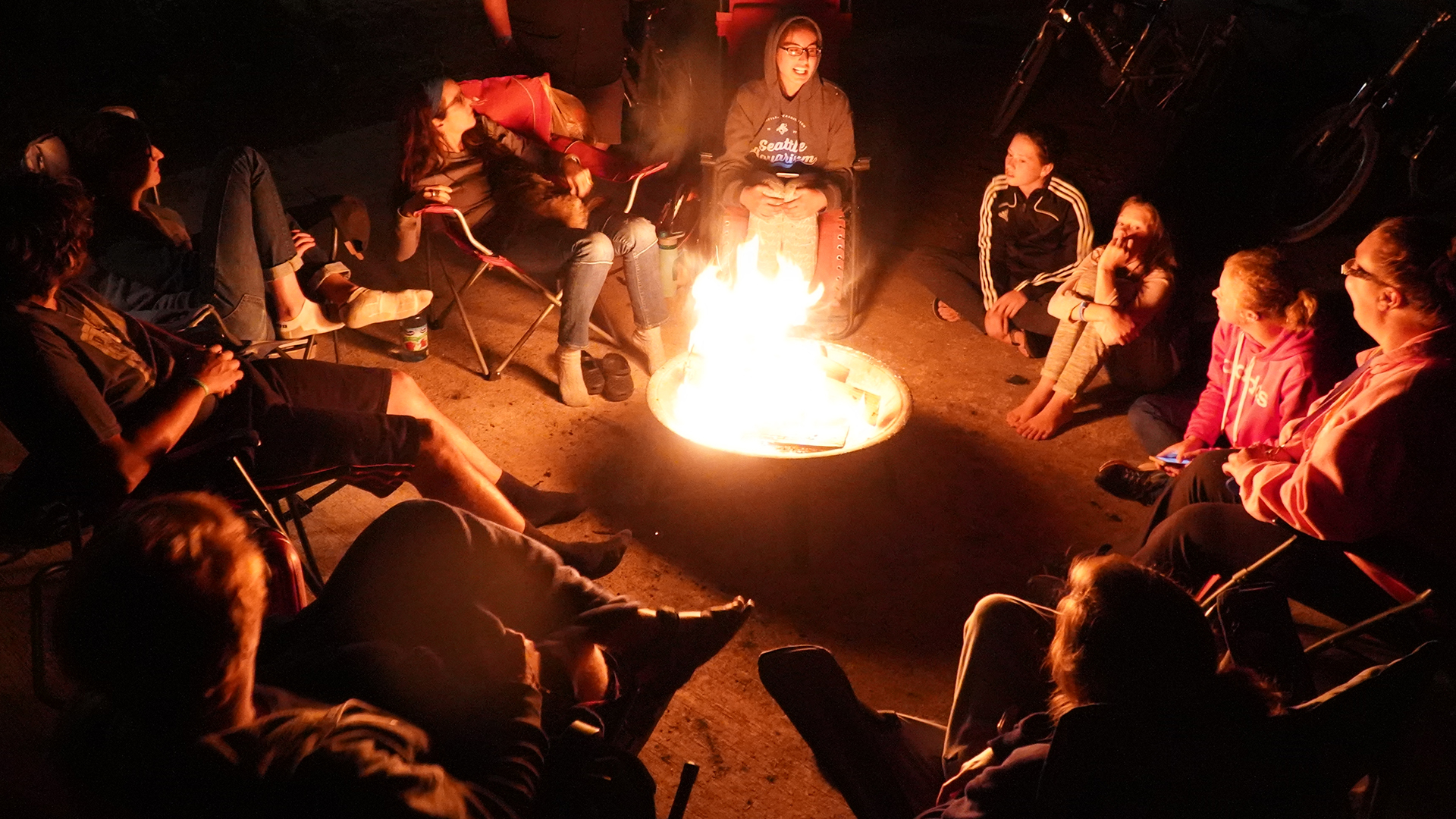 Community gathered around a campfire
