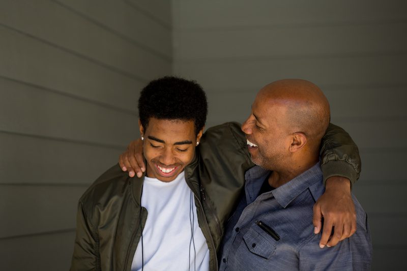 Father and son embracing
